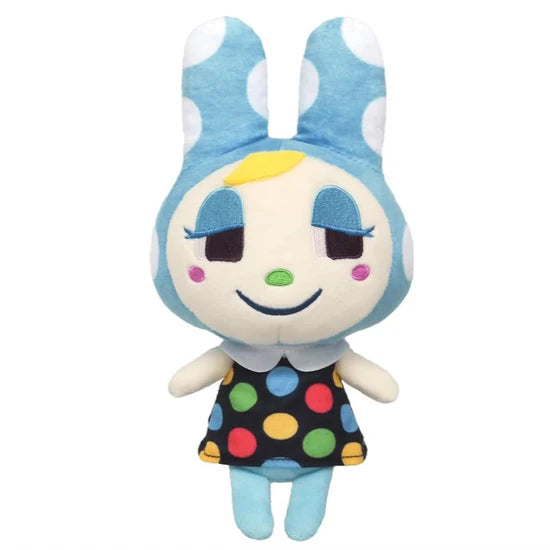 Plush toy with blue polka dot dress and bunny ears on a white background