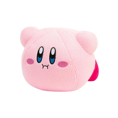 A pink textured plush toy shaped like Kirby, featuring embroidered blue eyes, pink cheeks, and a small red tail, isolated on a white background.